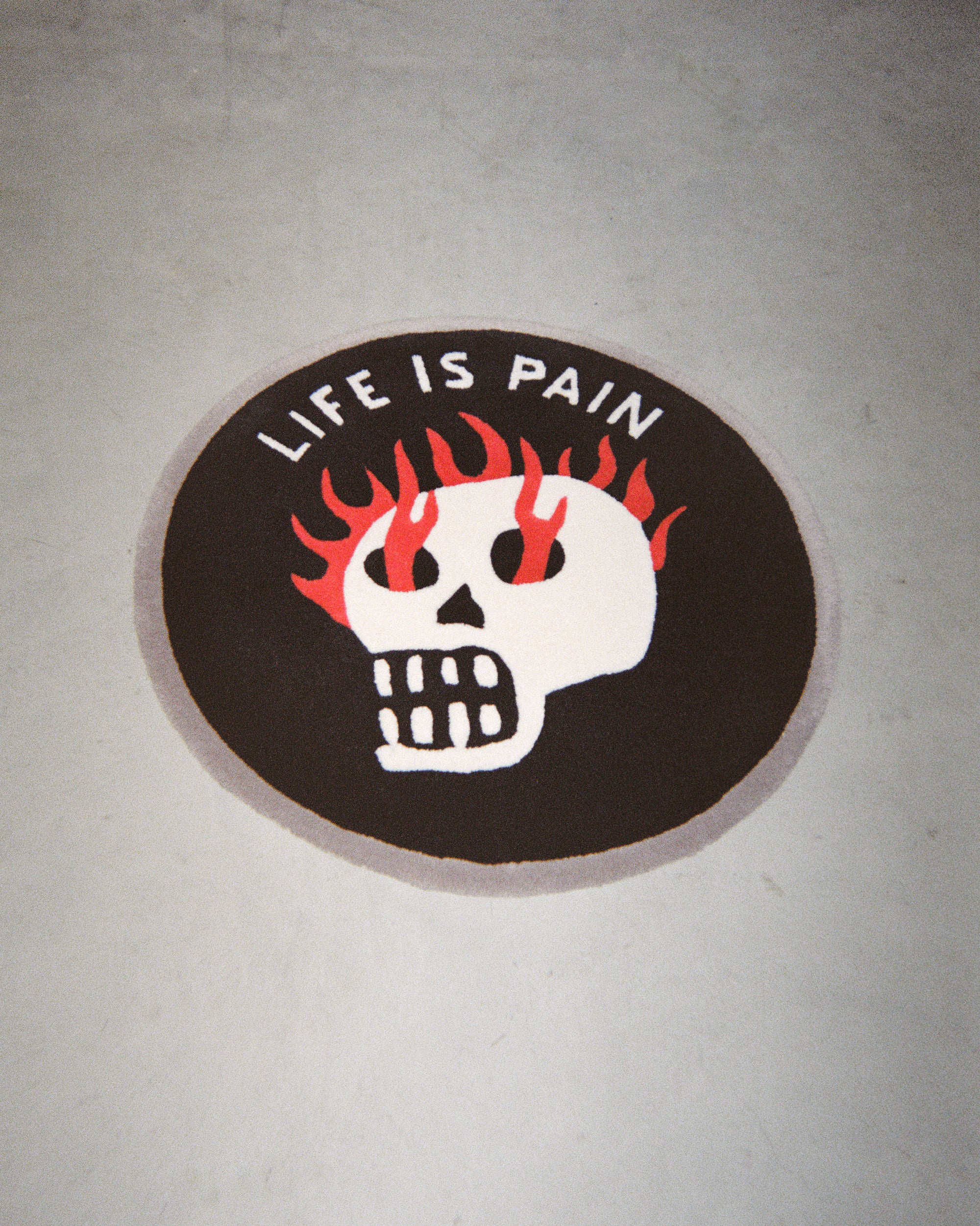 Life Is Pain Round Rug